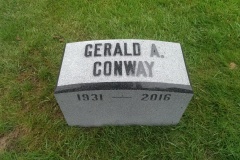 Photo of memorial grave marker with hand carved lettering