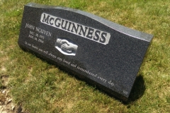 Photo of memorial grave marker with hand carved lettering