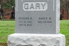 Photo of memorial grave marker with hand carved lettering