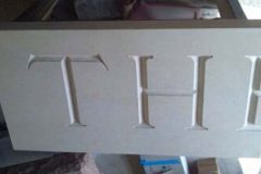 Photo of memorial grave marker with hand carved lettering
